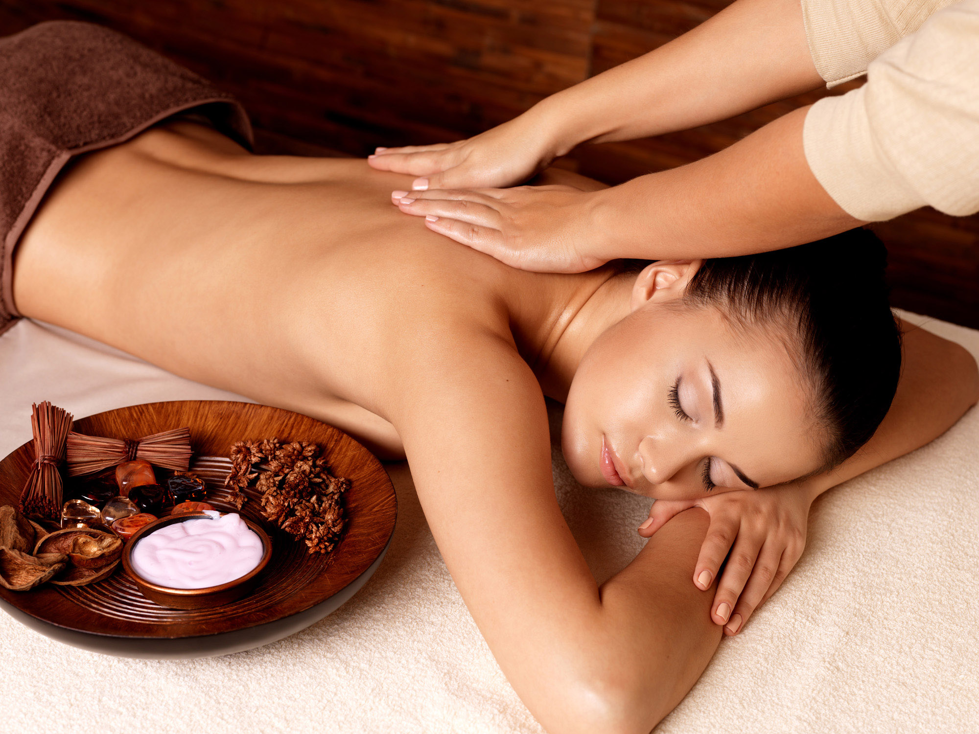 Masseur doing massage on woman body in the spa salon. Beauty tre